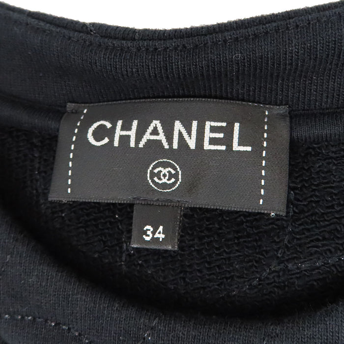 CHANEL  
COCO CC motivo totale bottone Coco  
Felpa con ricamo Camelia e logo Coco