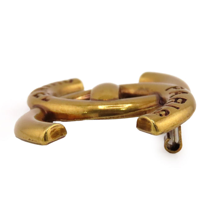 CHANEL  
COCO CC B21K métal couleur or  
Broche logo tourniquet Coco Mark