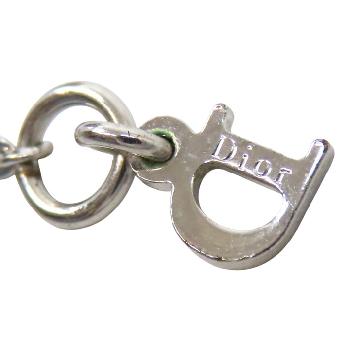 Dior  
Logo Trotter metallo color argento con strass colorati  
Collana con logo e strass