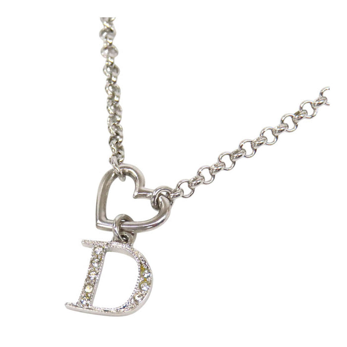 Dior 
Collier cœur ouvert et D ouvert avec logo et strass 
Fermoir couleur argent