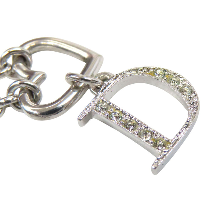 Dior 
Collier cœur ouvert et D ouvert avec logo et strass 
Fermoir couleur argent
