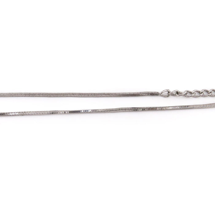 Dior  
Collier plaque Trotteur numéro 2 en métal couleur argent