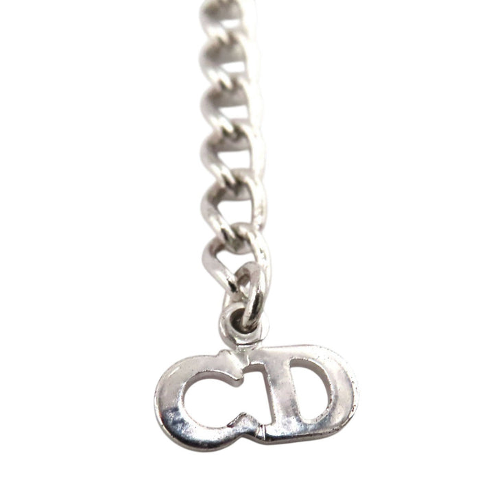 Dior 
Collier cœur logo vintage en métal couleur argent