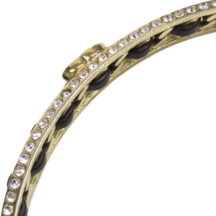 CHANEL 
Collier ras-du-cou B23P COCO CC logo en métal couleur or 
Marque Coco en cuir et strass