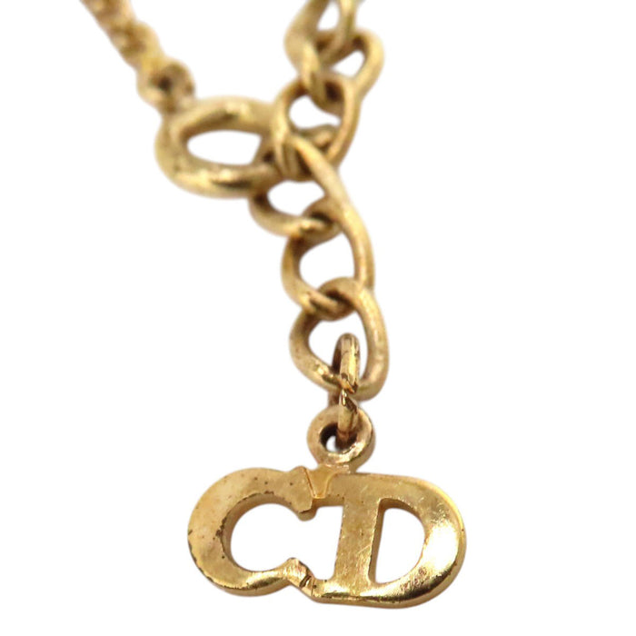Dior  
Collier cœur logo en métal doré vintage