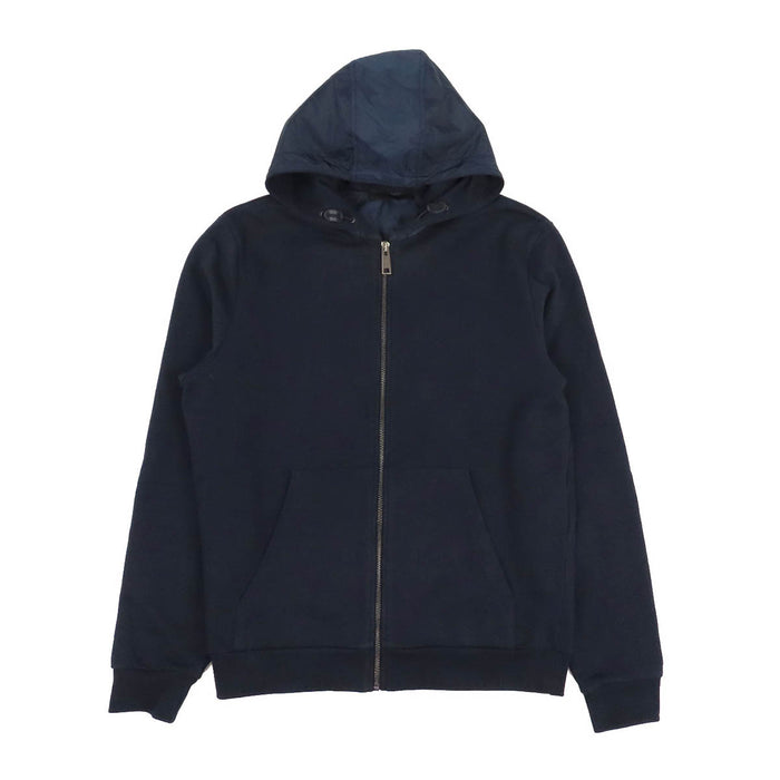 PRADA  
Sweat à capuche en coton avec logo en caoutchouc et empiècements en nylon  
Veste zippée avec logo latéral