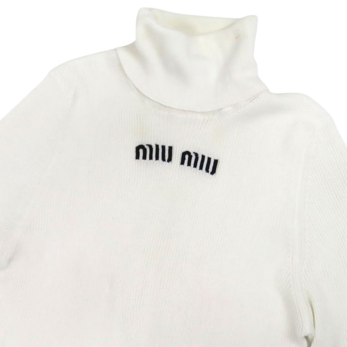 MIUMIU
Coton manches mi-longues
Col roulé à logo en maille côtelée