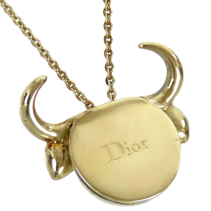 Dior 
Collier Tell Me Dior Taureau en métal doré avec logo, perles fantaisie et strass constellation