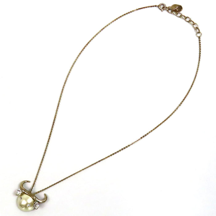 Dior 
Collier Tell Me Dior Taureau en métal doré avec logo, perles fantaisie et strass constellation