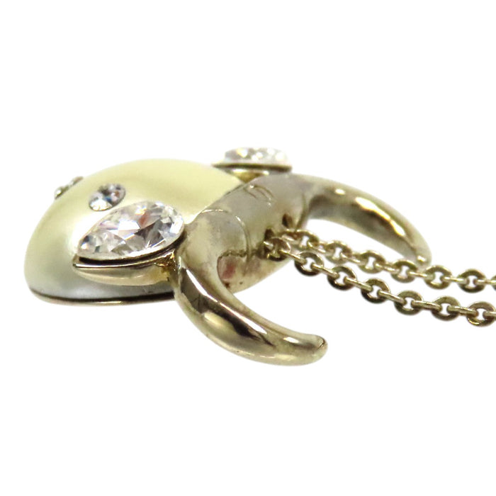 Dior 
Collier Tell Me Dior Taureau en métal doré avec logo, perles fantaisie et strass constellation