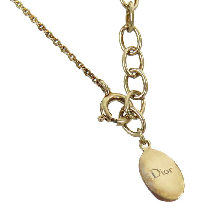 Dior 
Collier Tell Me Dior Taureau en métal doré avec logo, perles fantaisie et strass constellation