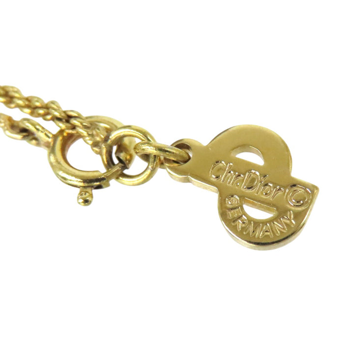 Dior 
Collier vintage en métal doré avec logo CD et strass