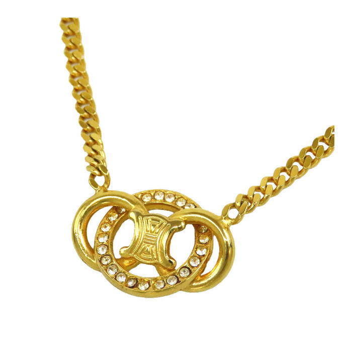 CELINE  
Chaîne en or à maillons plats avec strass et logo en métal doré  
Collier chaîne Macadam