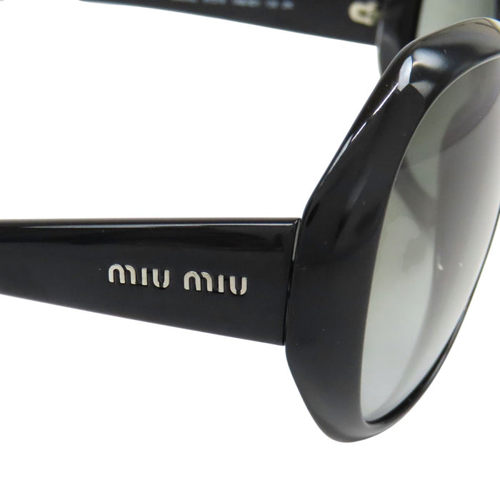 MIUMIU 
Lunettes de soleil logo