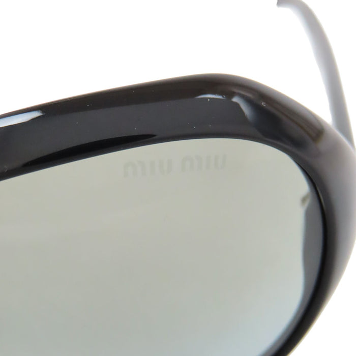 MIUMIU 
Lunettes de soleil logo
