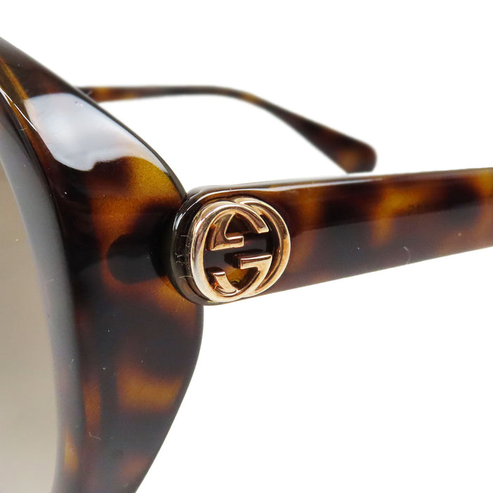 GUCCI 
Lunettes de soleil abeille à motif écaille 
Interlocking G