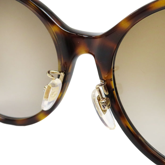 GUCCI 
Lunettes de soleil abeille à motif écaille 
Interlocking G