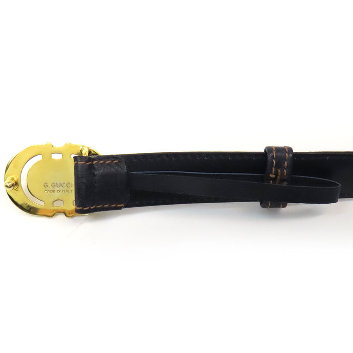 GUCCI 
Ceinture en cuir vintage 
avec logo GG en métal doré
