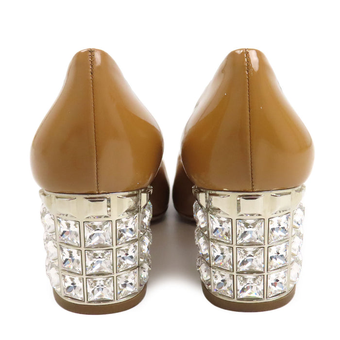 MIUMIU  
Boucles argentées Talon épais  
Escarpins vernis ornés de bijoux