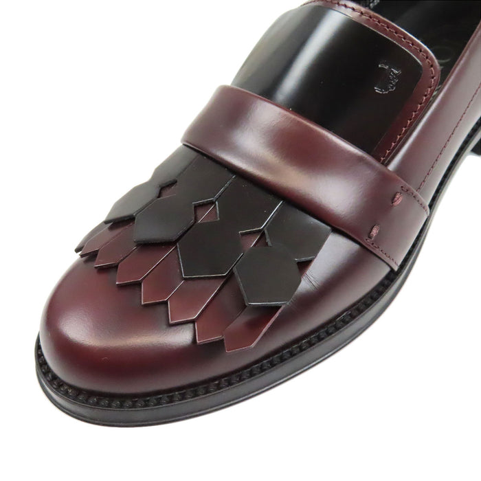 TOD’S 
Mocassins bicolores à franges et bout rond avec logo T