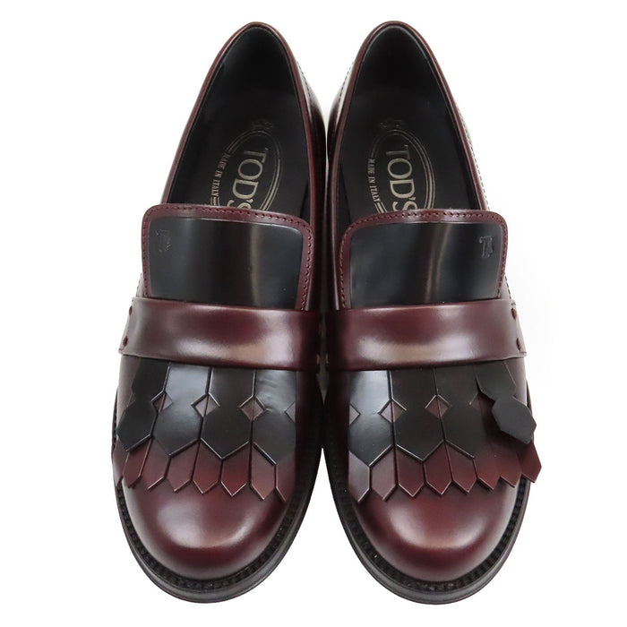 TOD’S 
Mocassins bicolores à franges et bout rond avec logo T