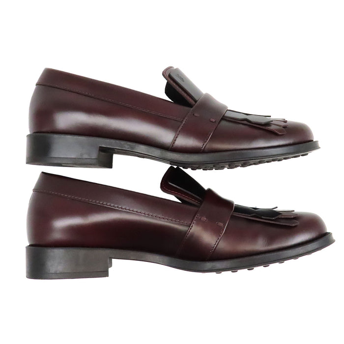TOD’S 
Mocassins bicolores à franges et bout rond avec logo T