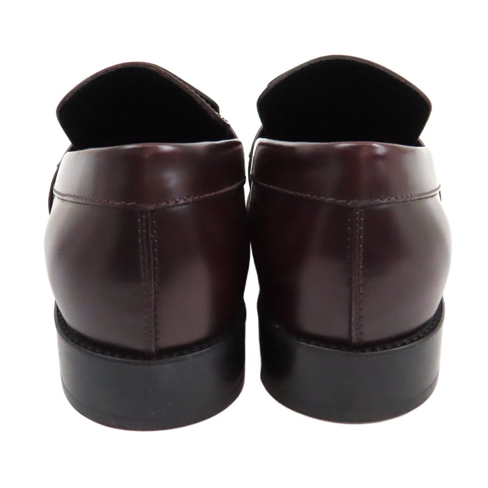 TOD’S 
Mocassins bicolores à franges et bout rond avec logo T