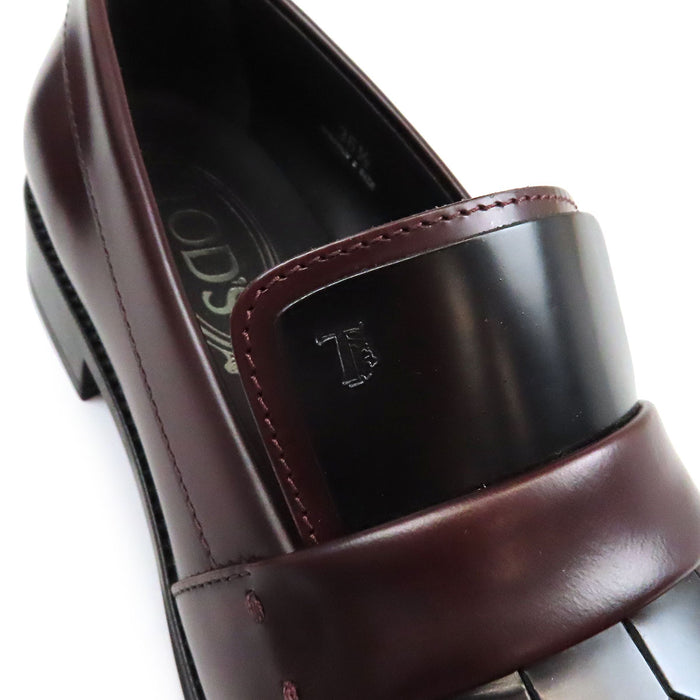 TOD’S 
Mocassins bicolores à franges et bout rond avec logo T