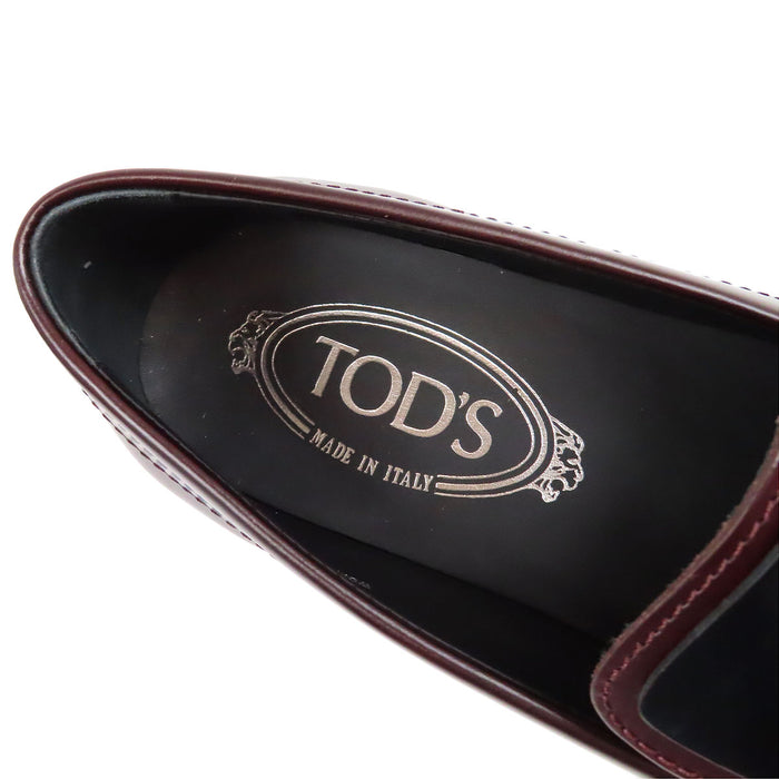 TOD’S 
Mocassins bicolores à franges et bout rond avec logo T