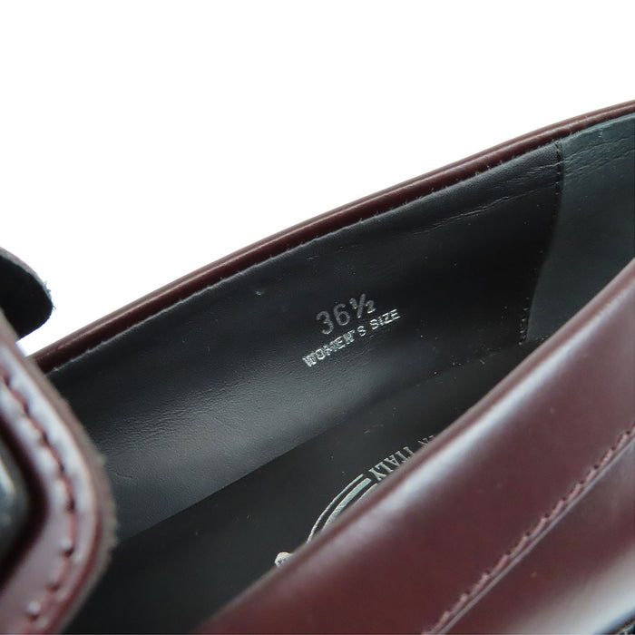 TOD’S 
Mocassins bicolores à franges et bout rond avec logo T