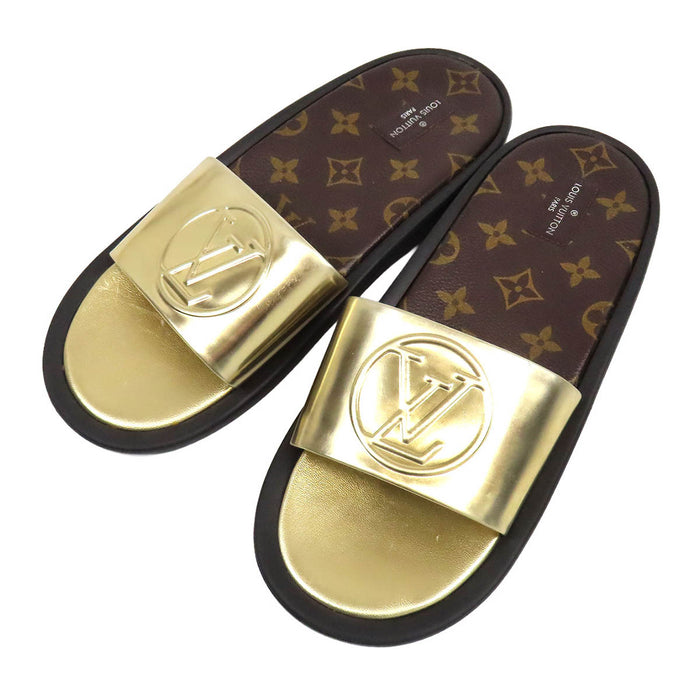 LOUIS VUITTON
Ciabatte a fascia LV Circle in pelle metallizzata
Sandali linea Sunburst
Monogramma