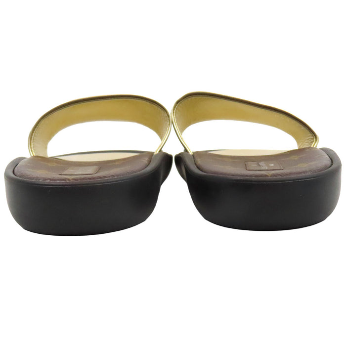 LOUIS VUITTON  
LV Circle Mule Slide Metallic Leather  
Sunburst Line Sandals  
Monogram