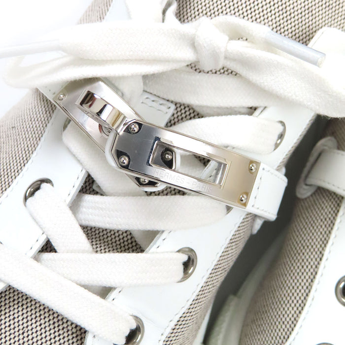 HERMES  
Logo Kelly Hardware Leather Low-Cut  
Day Canvas Sneakers