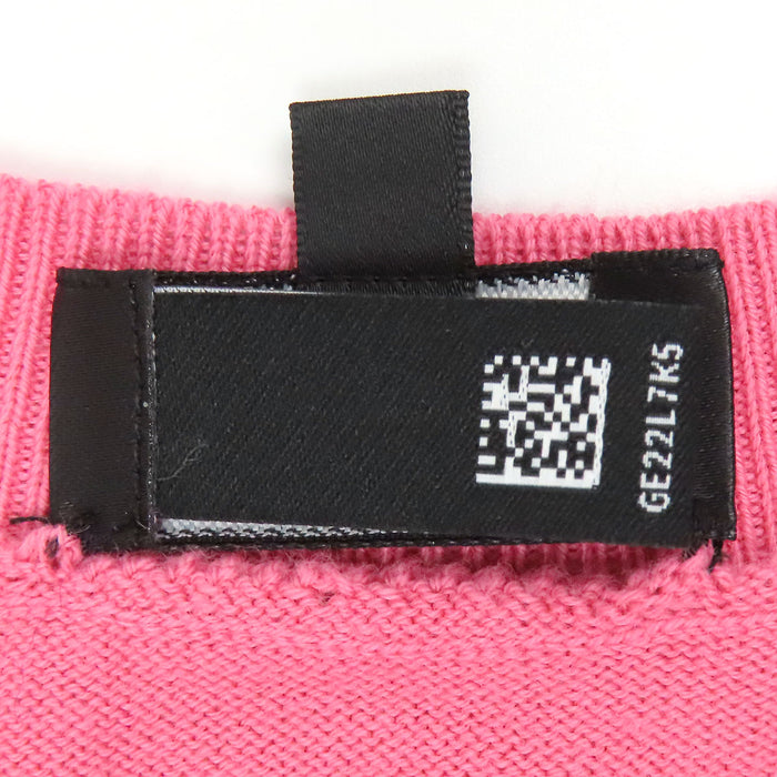 CHANEL  
Maglia a maniche lunghe con scollo a V, motivo iconico COCO CC, camelia e strass, lavorazione a coste