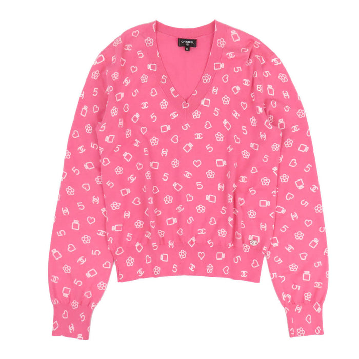 CHANEL  
Maglia a maniche lunghe con scollo a V, motivo iconico COCO CC, camelia e strass, lavorazione a coste