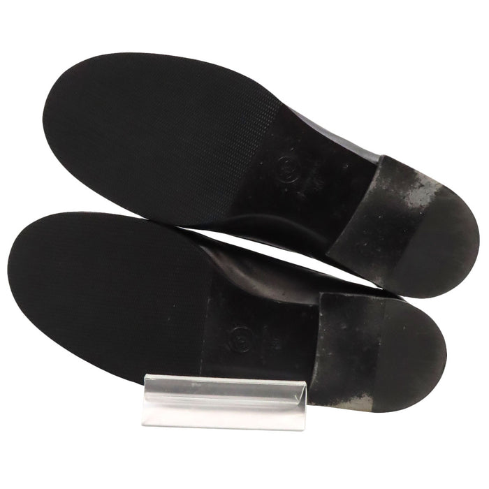 CHANEL 
Mocassins en cuir avec logo COCO CC et ferrures dorées