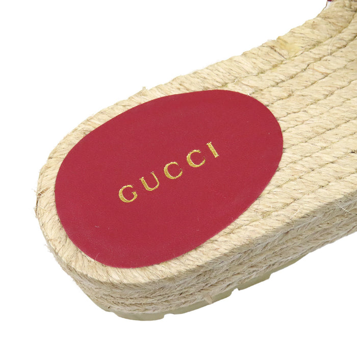 GUCCI 
Sandales plateforme en cuir avec logo et métal couleur or 
Espadrilles GG toile