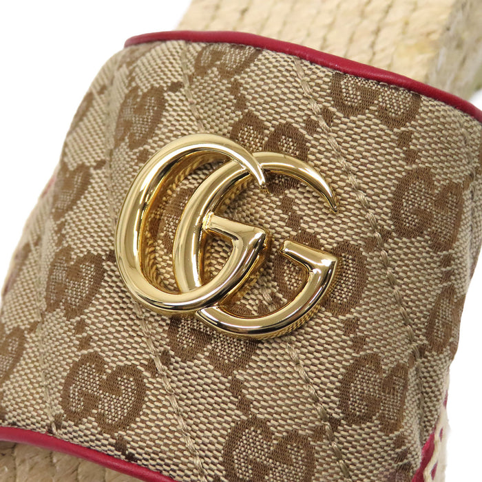 GUCCI 
Sandales plateforme en cuir avec logo et métal couleur or 
Espadrilles GG toile