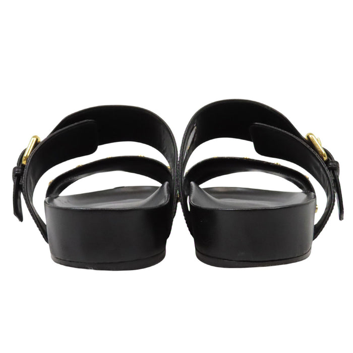 LOUIS VUITTON 
LV ロゴ フラット サンダル ゴールドカラーメタル 
モノグラム スタッズ レザー ミュール