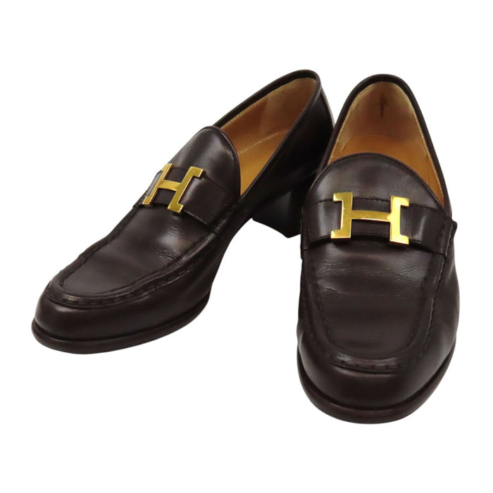 HERMES 
Mocassins à talon Constance en cuir avec logo H Ash et ferrures dorées