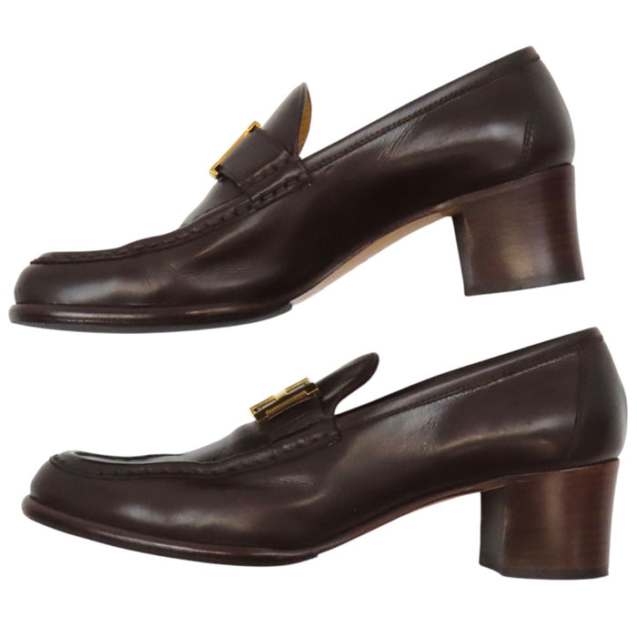HERMES 
Mocassins à talon Constance en cuir avec logo H Ash et ferrures dorées