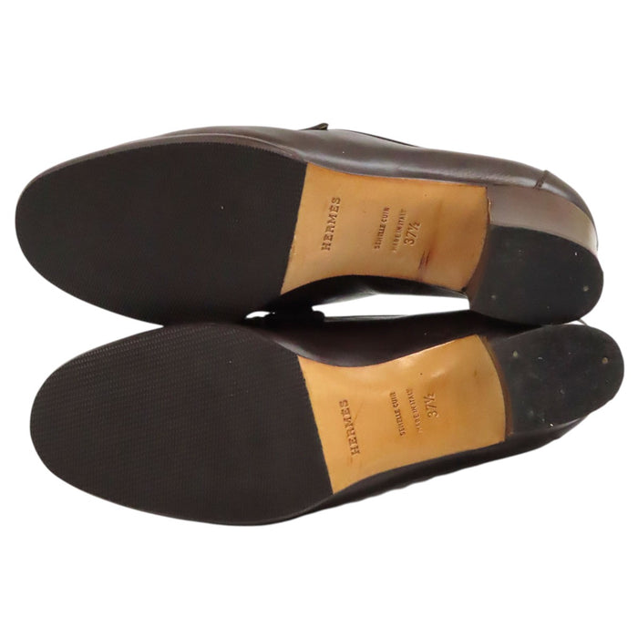 HERMES 
Mocassins à talon Constance en cuir avec logo H Ash et ferrures dorées