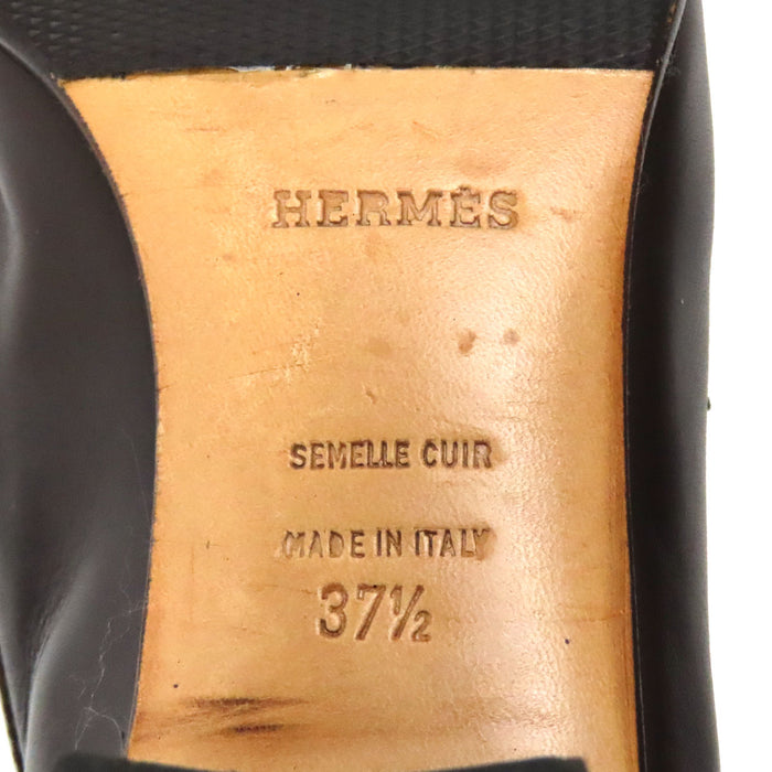 HERMES 
Mocassins à talon Constance en cuir avec logo H Ash et ferrures dorées