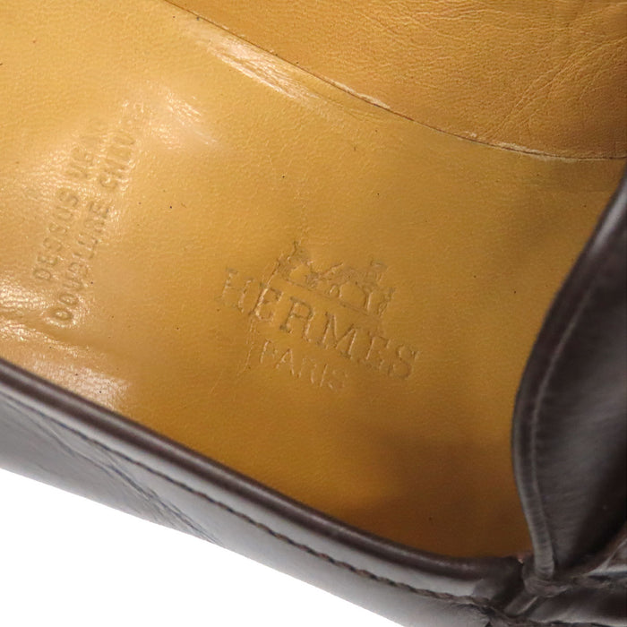 HERMES 
Mocassins à talon Constance en cuir avec logo H Ash et ferrures dorées