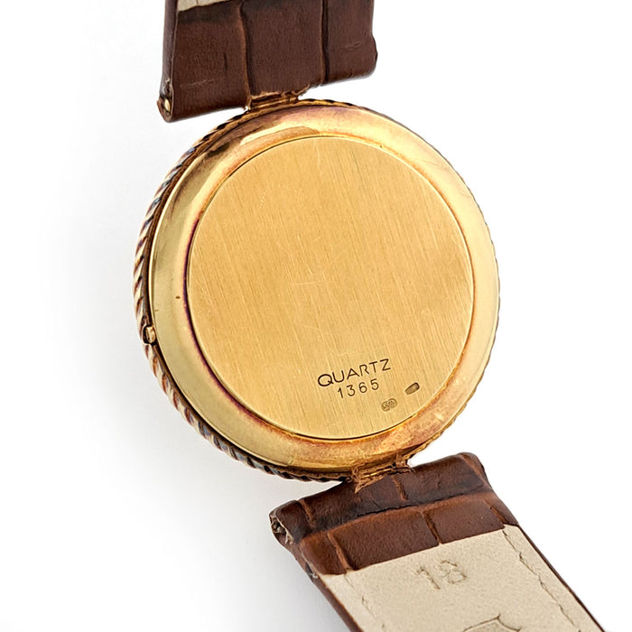 OMEGA 
Vintage Round