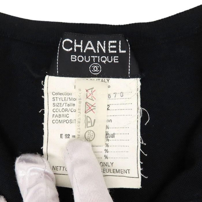 CHANEL 
Bouton Coco CC vintage laine 30870 
Robe tricotée logo Coco