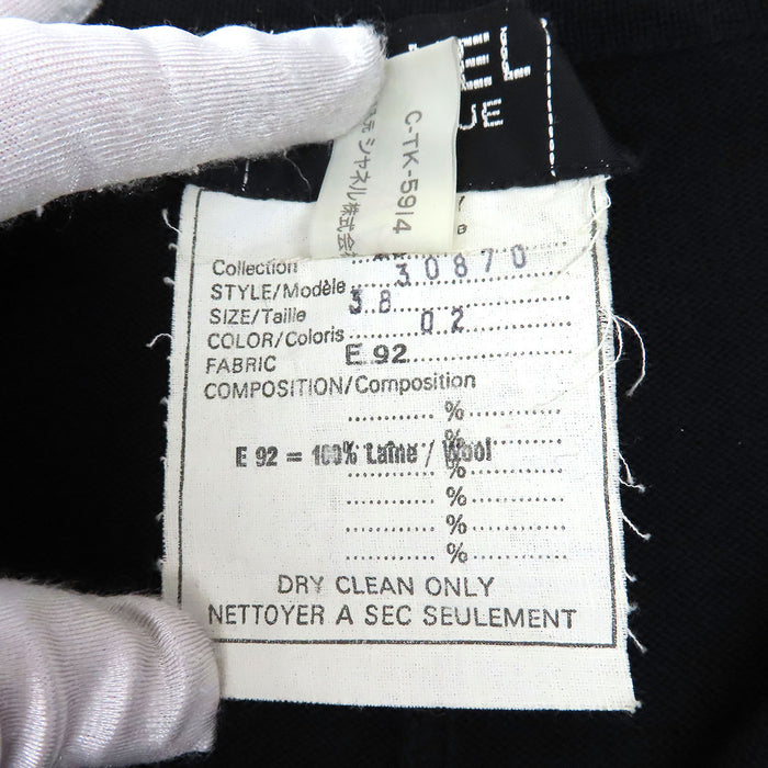 CHANEL 
Bouton Coco CC vintage laine 30870 
Robe tricotée logo Coco