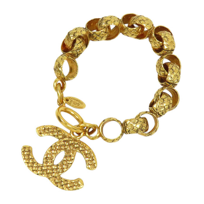 CHANEL  
29 COCO CC Bracciale vintage in metallo color oro con catena e logo Coco, anno 1994
