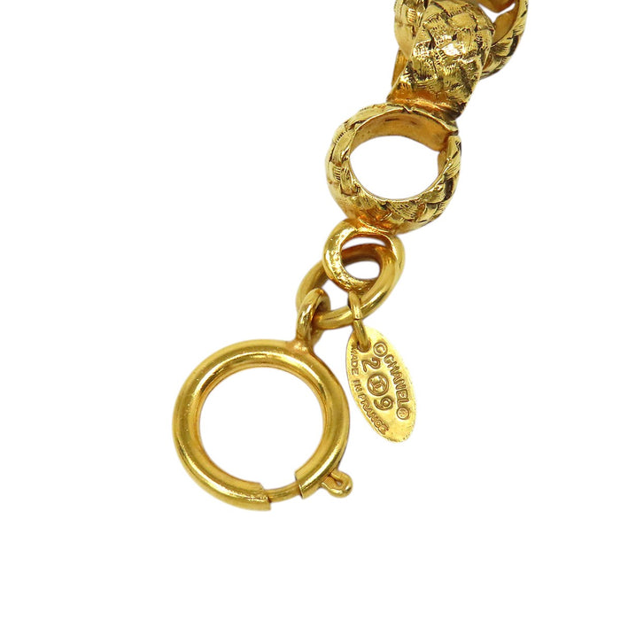 CHANEL  
29 COCO CC Bracciale vintage in metallo color oro con catena e logo Coco, anno 1994