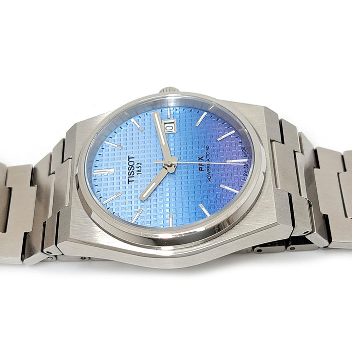 TISSOT  
PRX sfumatura blu  
Con scatola e garanzia